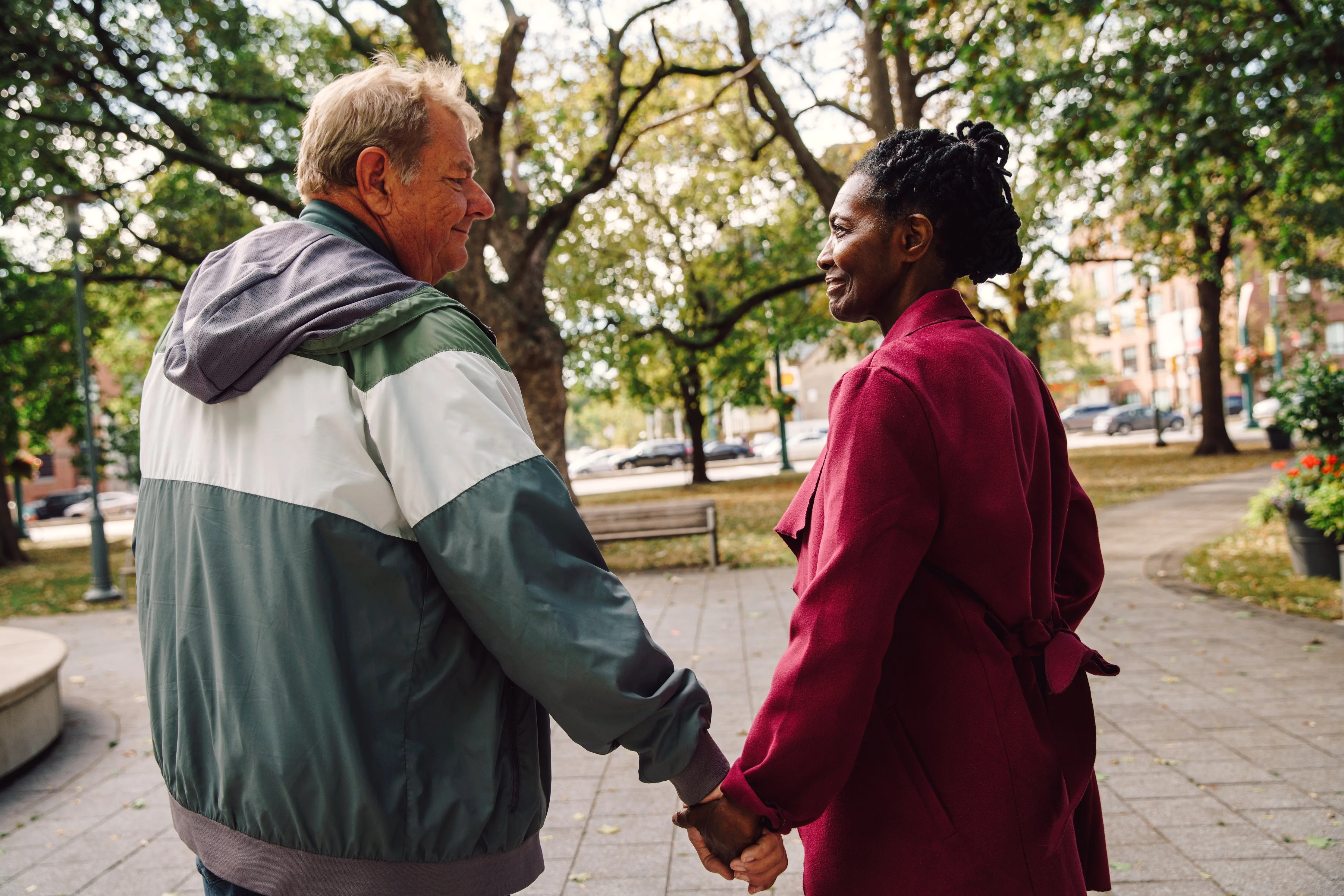 Old couple holding hands