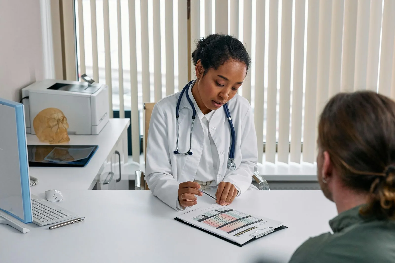 Doctor taking patient notes